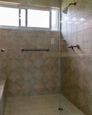 Master bathroom shower with seat